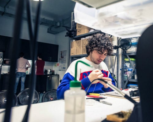 Employee at work inside the Adafruit factory