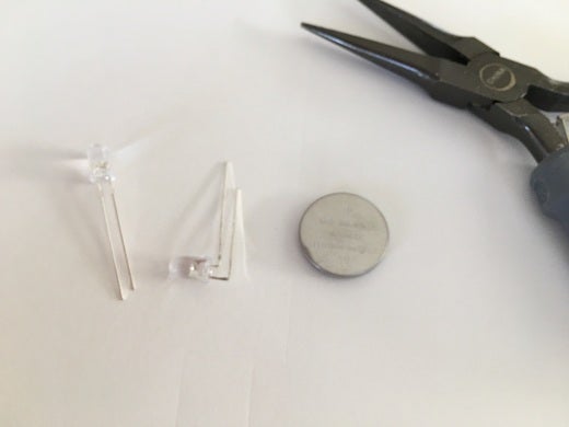 Attach LEDs to battery. Attach LEDs to battery.