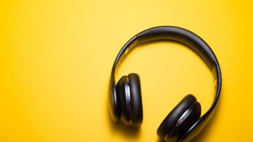 Headphones on a yellow backdrop
